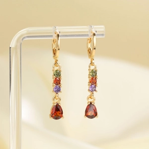 Gold tassel earrings with multi-color cubic zirconia and red teardrop pendants