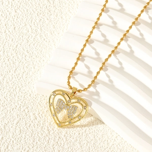 Elegante collar de corazón dorado con colgante de lazo de circón y cadena de bolas