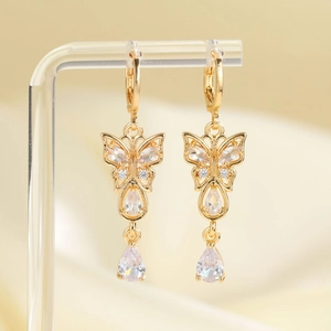 Elegant gold butterfly drop earrings featuring shimmering cubic zirconia and pear-cut charms