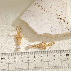 Elegant gold butterfly drop earrings with zircon crystals and pear-shaped stone pendant