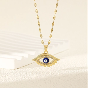 Golden Evil Eye pendant necklace with blue zircon and textured wavy chain for women
