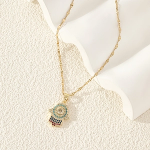 Hamsa Hand necklace in gold finish with colorful zircon stones and Evil Eye motif