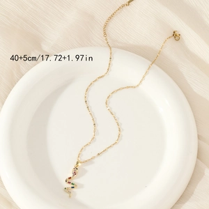 Minimalist snake pendant necklace in gold finish with colorful gemstones and sparkly zircons