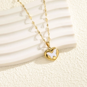 18K gold butterfly heart pendant necklace with white shell inlay on a white background