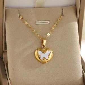 Elegant 18K gold heart necklace with white shell butterfly pendant in a jewelry gift box