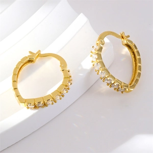 Elegant gold-plated heart hoop earrings featuring white cubic zirconia accents