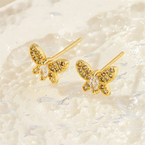 Elegant gold butterfly stud earrings with sparkling cubic zirconia on a white texture