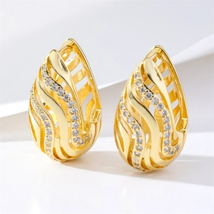 Elegant gold drop earrings with hollow wavy design and sparkling zircon stones
