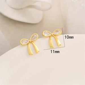 Boucles d'oreilles nœud doré avec zircon sur céramique blanche, taille 10mm x 11mm