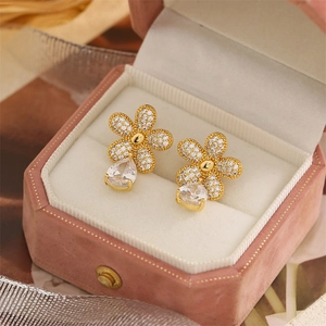 Elegant gold flower earrings with pavé zircons and crystal teardrop pendants in a box