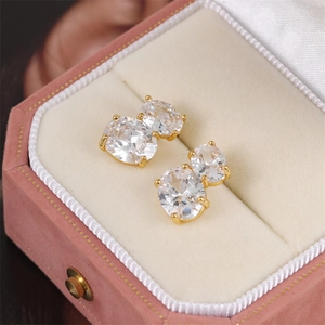 Elegant gold earrings with double oval cubic zirconia stones in a four-prong setting