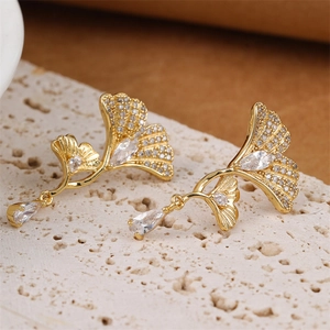 Elegant gold ginkgo leaf drop earrings with zircon crystals and pear shape stone