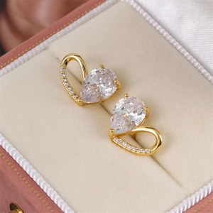 Elegant gold-plated heart-shaped drop earrings with pear-cut zircon in a pink jewelry box