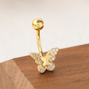 Piercing de nombril papillon doré orné de zircons cubiques et barre incurvée