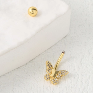 Piercing de nombril papillon doré avec cristaux de zircon sur présentoir blanc