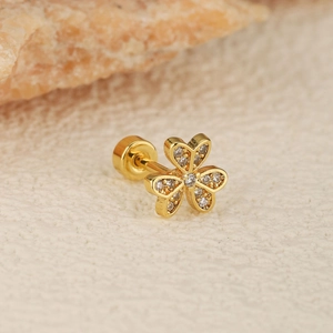 Macro shot of clover-shaped stud earring with cubic zirconia and screw ball back