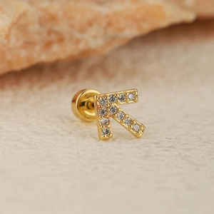 Golden letter K cartilage piercing stud earring with clear zircon crystals and screw back