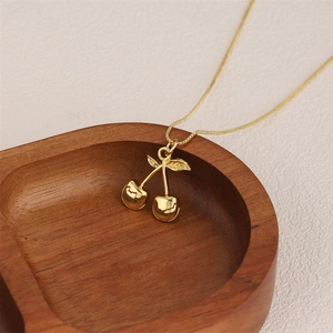 Elegant 18k gold plated stainless steel necklace featuring a cherry pendant and fine chain