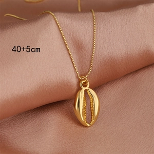 Gold stainless steel conch shell necklace on purple silk background with 40+5cm chain