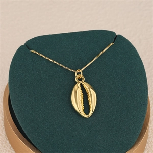 Golden shell pendant necklace with mirror finish on box chain in ocean style for women