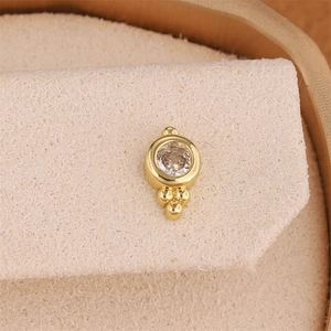 Star-shaped 18K gold plated earring with sparkling zircon stone and three metal beads