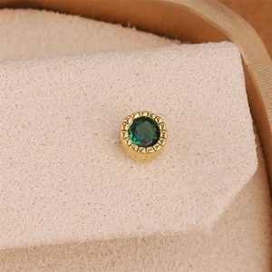 Round 18K gold plated stud earrings with a green zircon star and wavy edge