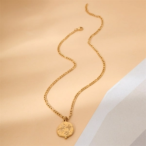 Golden sun pendant necklace with bohemian geometric engravings on a minimalist chain