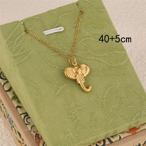 18K gold plated stainless steel elephant pendant necklace on green jewelry box