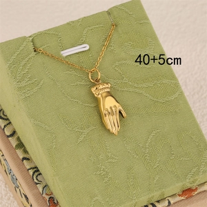 Golden hand pendant necklace in vintage style with 40+5cm adjustable chain on green fabric