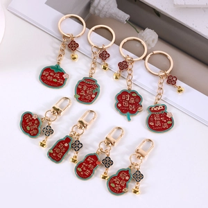 Traditional Chinese style lucky charms keychain collection with gold metal frames and enamel