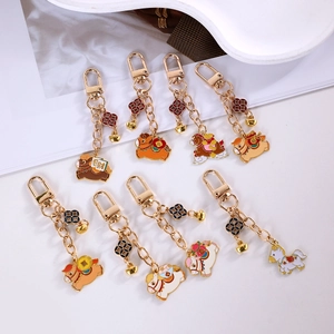 Detailed flat lay of eight colorful zinc alloy running horse keychains with gold charms