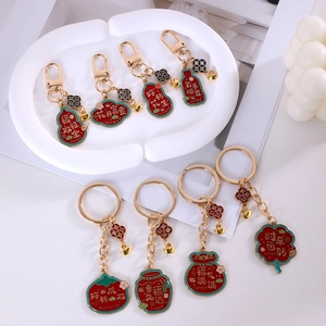 Detailed close-up of lucky charms keychain set with gold plating and enamel finish