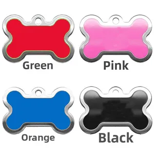 Detail view of bone-shaped pet ID tags in red, pink, blue, and black glitter finish
