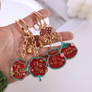 Traditional Chinese style metal keychains with lucky charms in red and green enamel finish