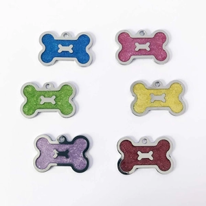 Glitter bone-shaped pet ID tags in blue, pink, green, yellow, purple, and red colors