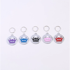 Set of five colorful metal crown pet ID tags with bone detail in purple, blue, black, pink, red