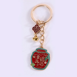 Japanese style lucky sake jar keychain with gold ingot and flower charms in red and gold