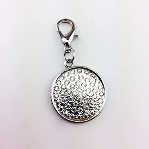 Silver metal dog tag with flower relief and lobster clasp for pet collars