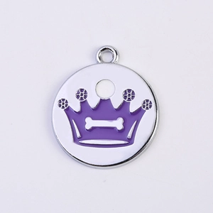 Detail of round purple crown pet ID tag with bone cutout for dog collar attachment