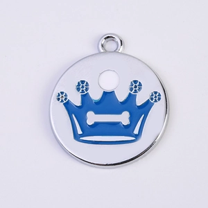 Close-up of a round blue enamel pet ID tag featuring a crown and bone design