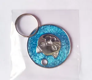 Detail of round glitter blue cat ID tag with silver relief and 14mm steel ring