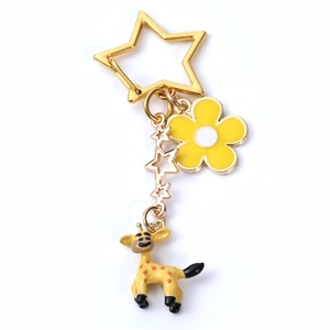 Cute cartoon giraffe keychain with yellow flower and gold star charm for bags