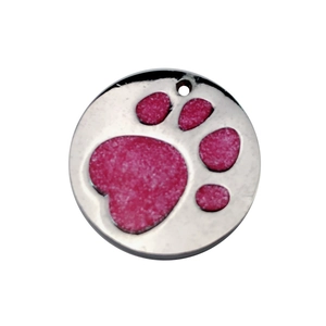 Close-up of a silver round pet ID tag with a pink glitter heart-shaped paw print design