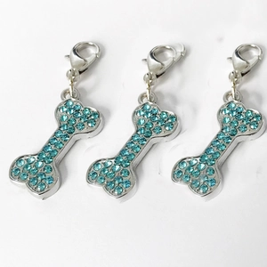 Sparkling bone-shaped dog tags with light blue rhinestones and silver lobster clasps