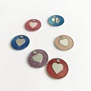 Detailed top view of 6 colorful glitter pet ID tags with heart design in a circular layout