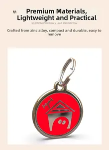 Detail of red zinc alloy dog house ID tag with polished silver frame and metal ring