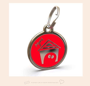 Detail of round zinc alloy pet ID tag with red house motif and durable metal hook