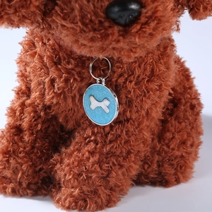 Sparkling blue round pet ID tag with silver bone emblem on a dog collar necklace