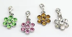 Detail showing four flower petal pendants with colorful rhinestones and lobster clasps