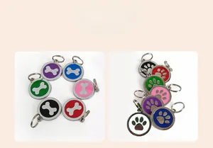 Detailed display of colorful metal pet ID tags in bone and paw print shapes